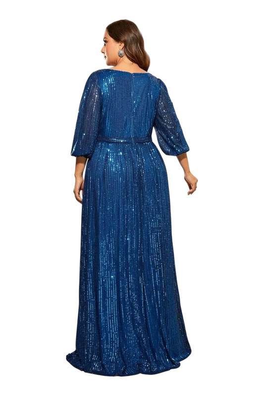 Woman wearing a blue sequin dress against a neutral background