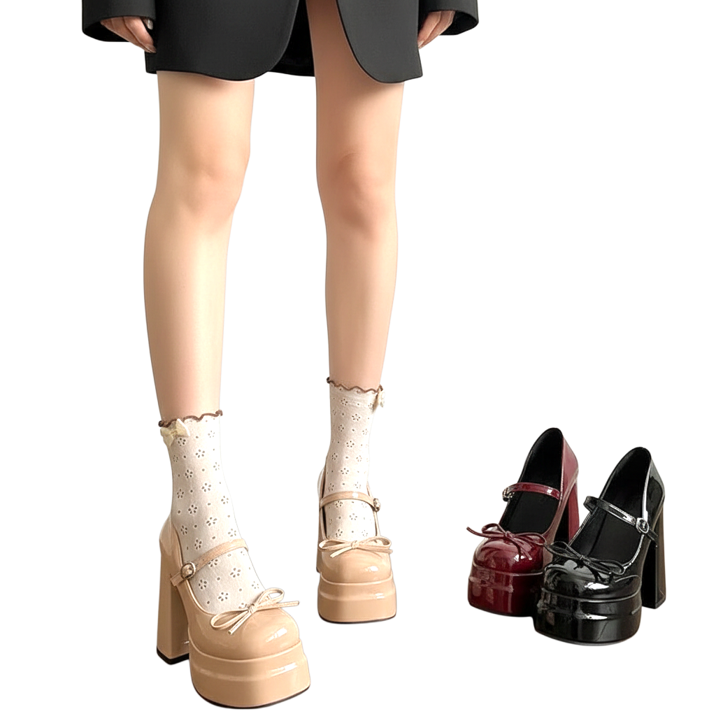 JASE Heart beige patent leather platform Mary Jane heels with bow detail worn with patterned socks