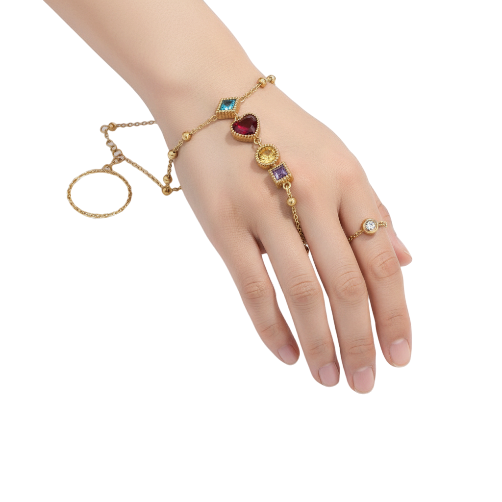 JASE HEART GLOBAL gold hand chain bracelet featuring multi-colored gemstone charms and a matching finger ring