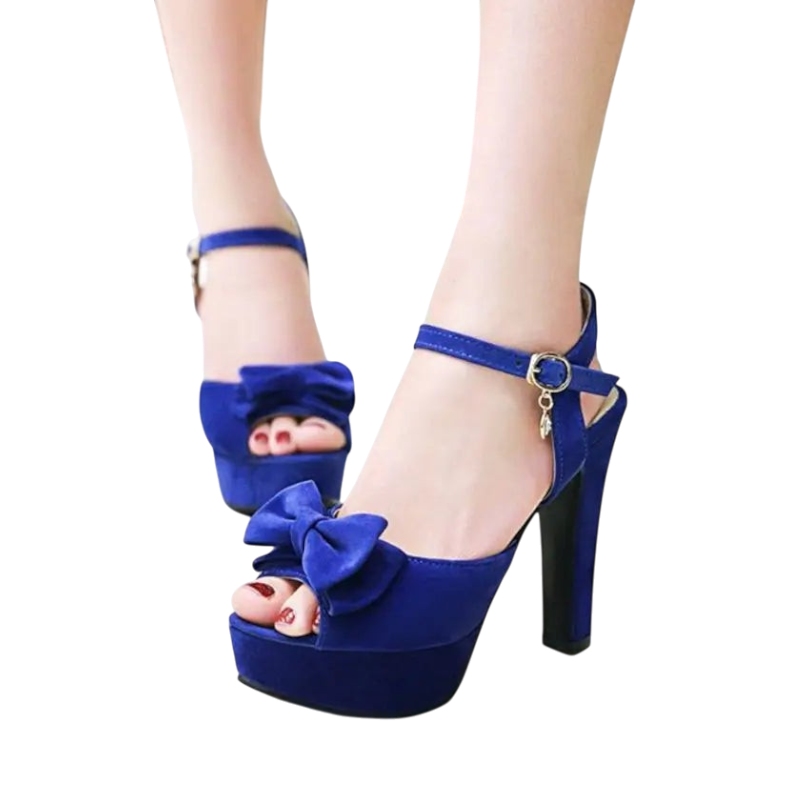 JASE Heart blue velvet platform high heel sandals with a bow detail and ankle strap worn on feet
