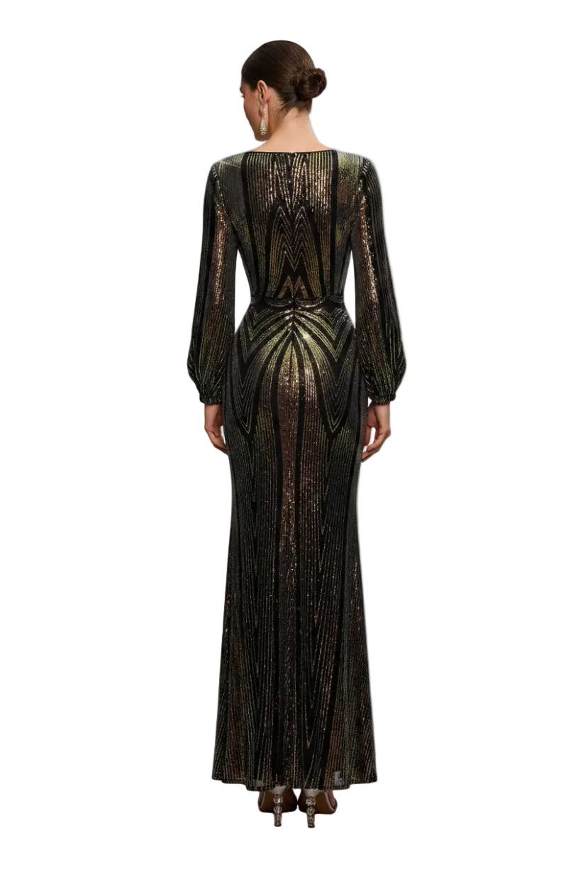 Woman wearing a black and gold sequin dress in a softly lit room.