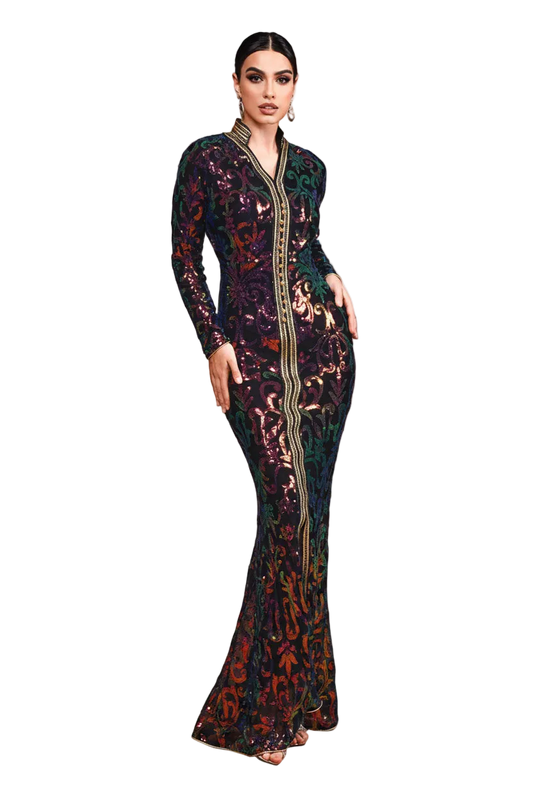 Woman in a patterned dress standing in desert sand dunes with 'Miss Qord' branding.