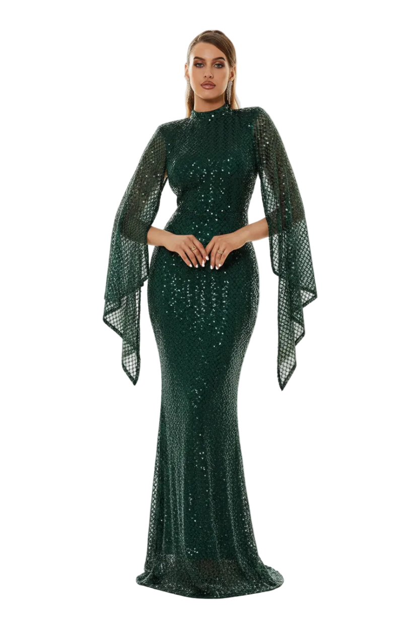 Woman wearing a green sequin dress with a matching shawl in an outdoor setting.