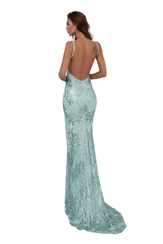 Woman wearing a light blue evening gown with a backless design in an elegant indoor setting.