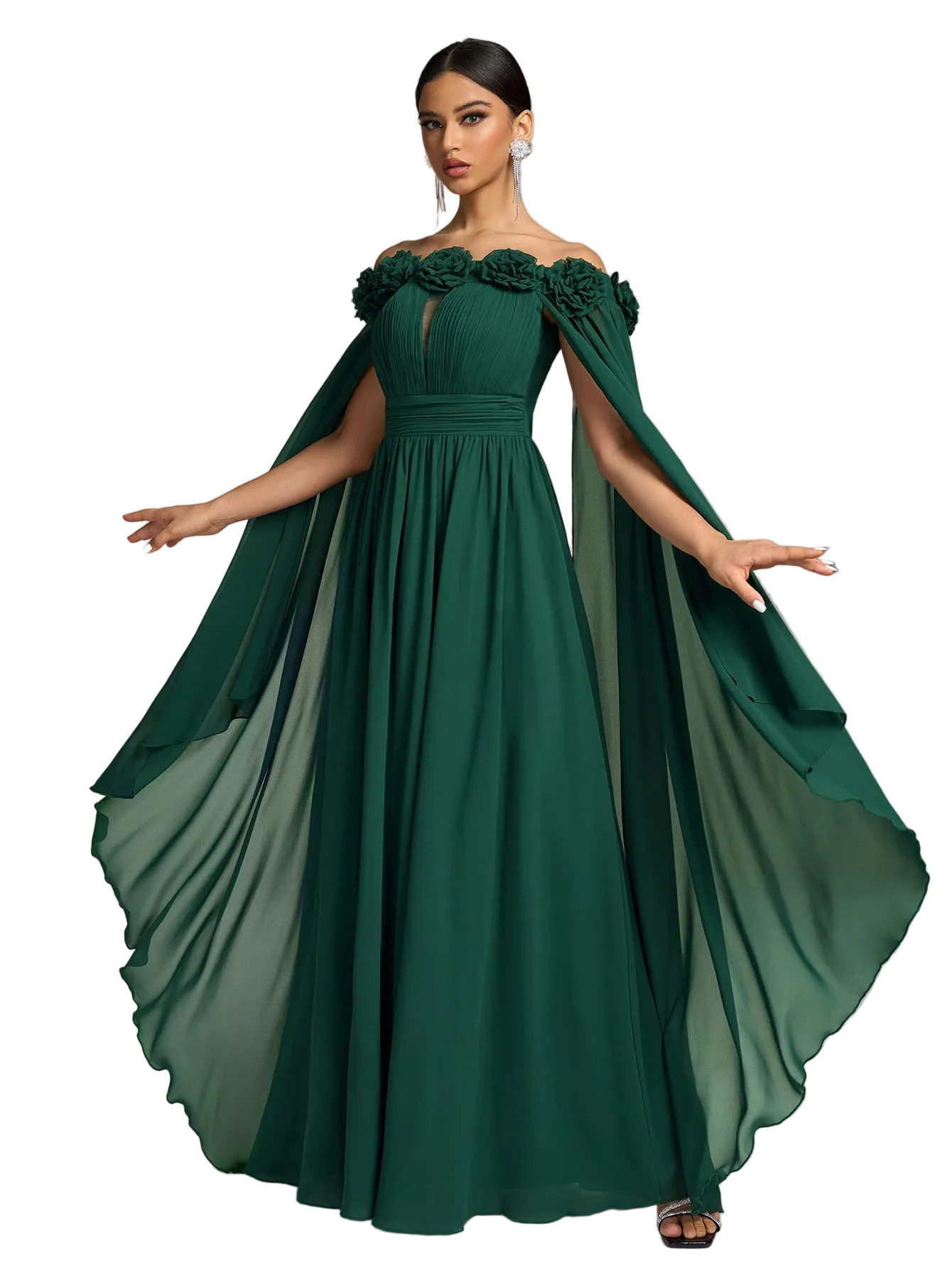 Woman wearing a green evening gown with a cape on a gray background