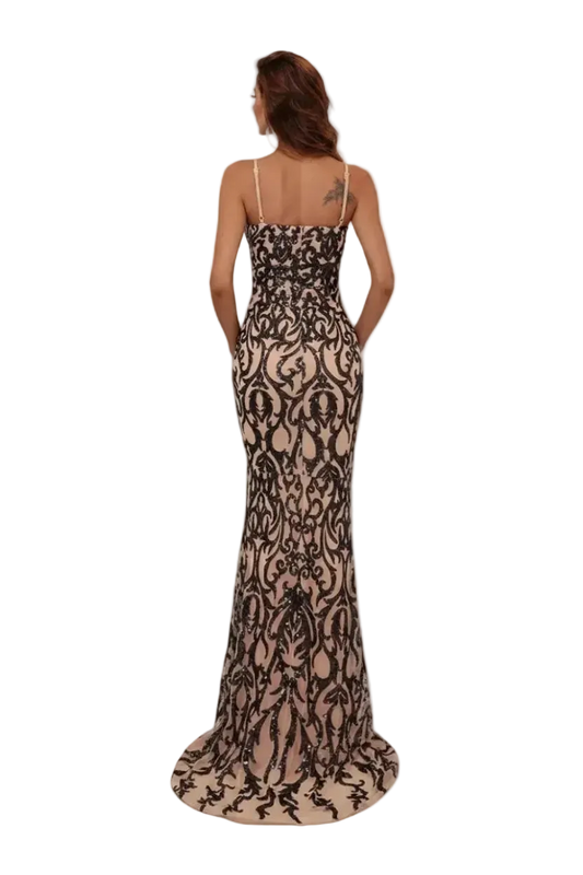 Woman wearing a black lace evening gown on a white background