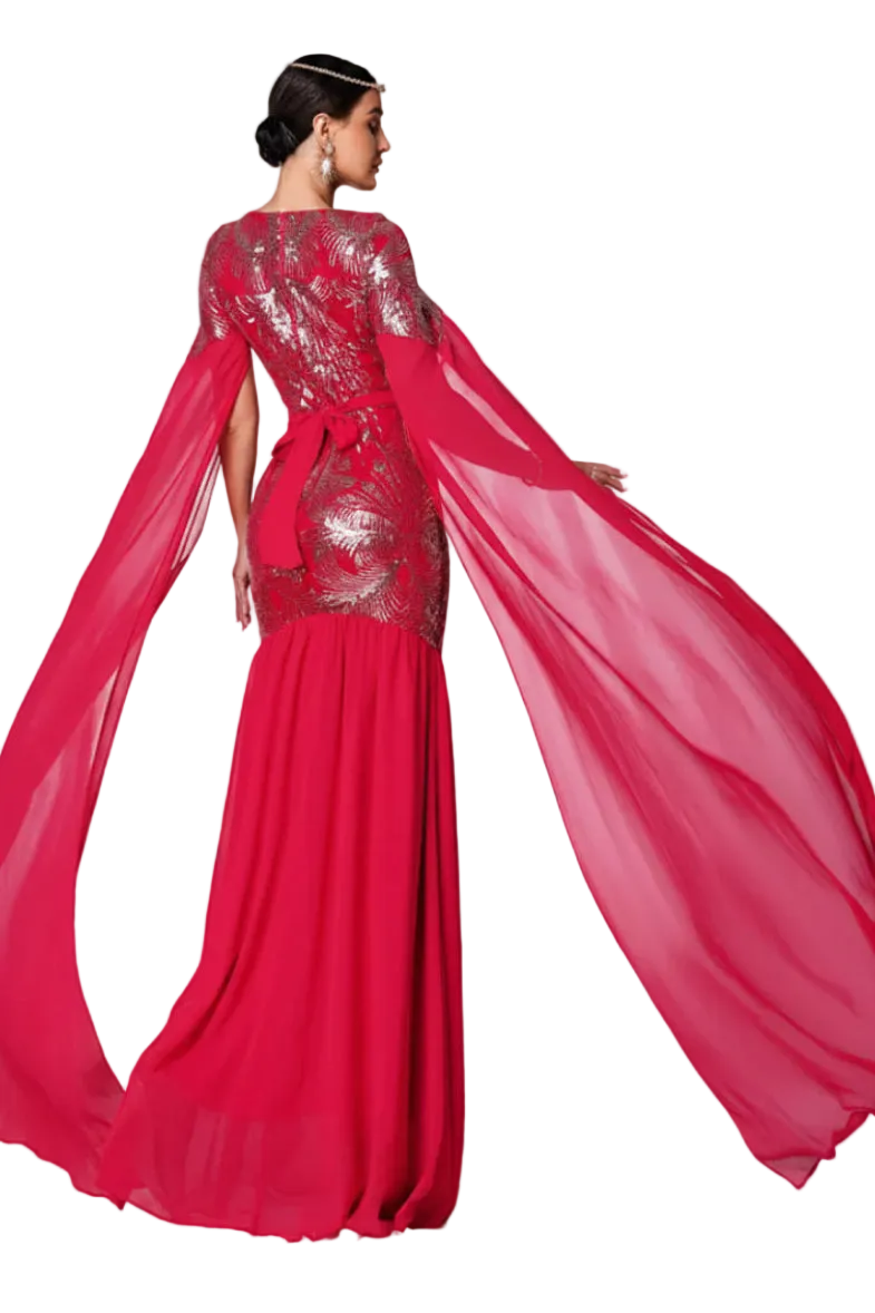 Red evening gown with a sheer overlay on a white background