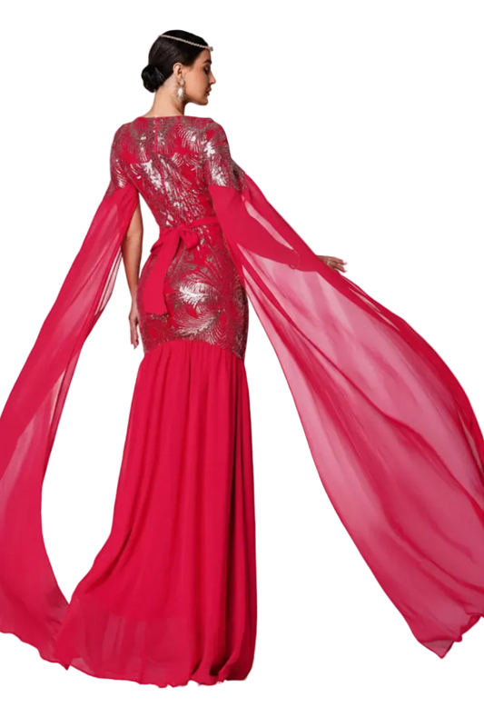 Red evening gown with a sheer overlay on a white background