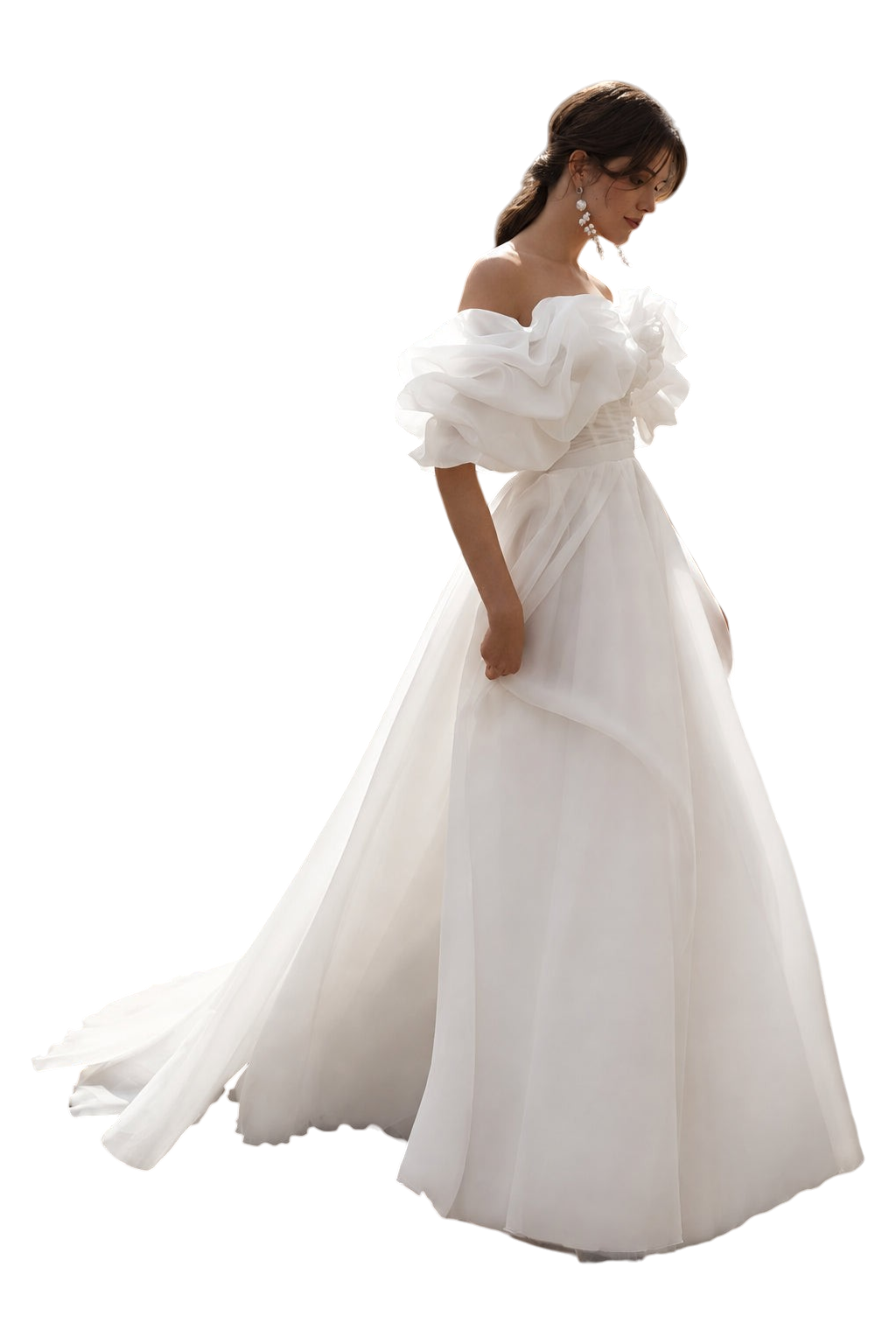 JASE Heart Ethereal Volante white off-the-shoulder wedding dress with voluminous organza ruffles on a city street