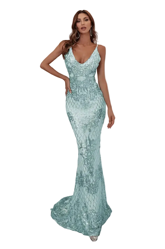 Woman wearing a light blue evening gown in an elegant interior setting