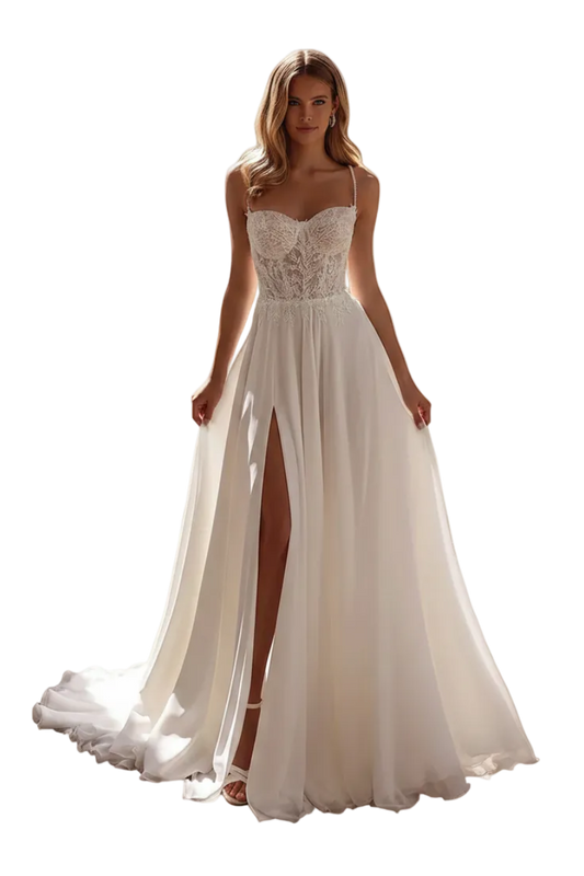 A woman models a white A-line wedding dress with a lace corset bodice, spaghetti straps, and a high thigh slit, standing in an outdoor patio setting with columns and potted plants.