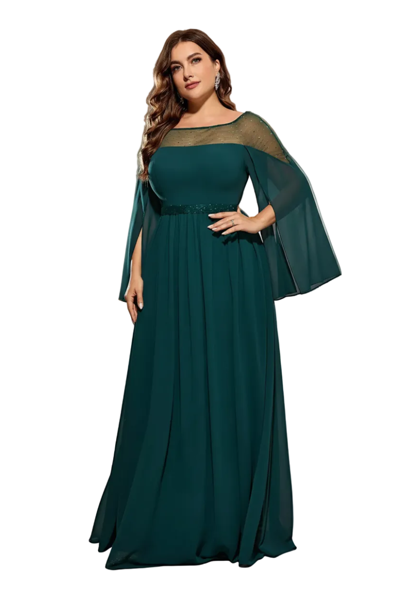 Woman wearing a teal evening gown with a sheer overlay on a gray background