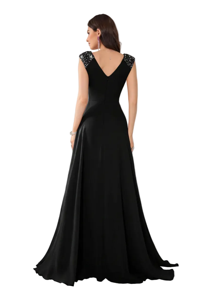 Black evening gown with beaded straps on a white background