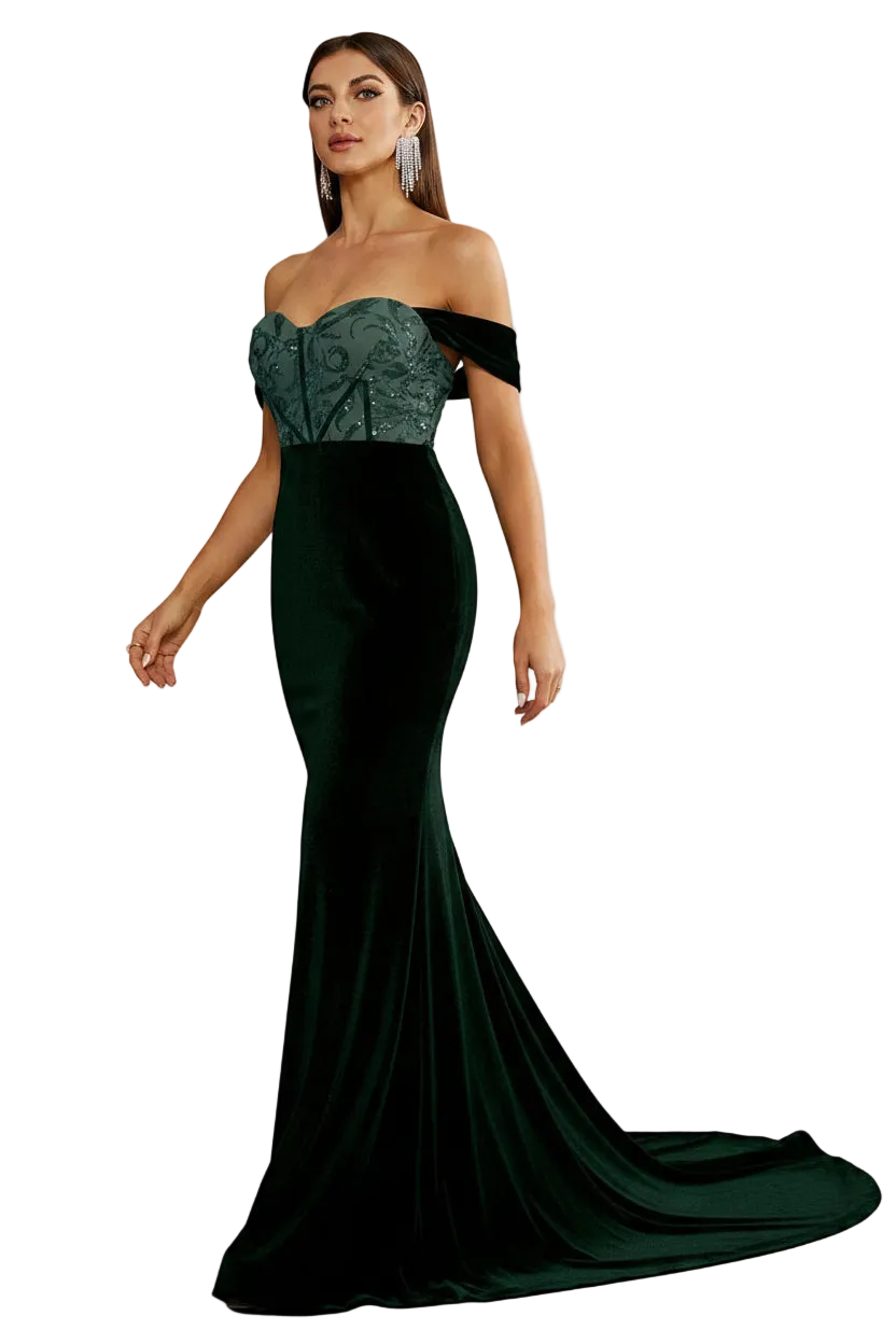 Woman wearing a green evening gown with a long train in an elegant room.