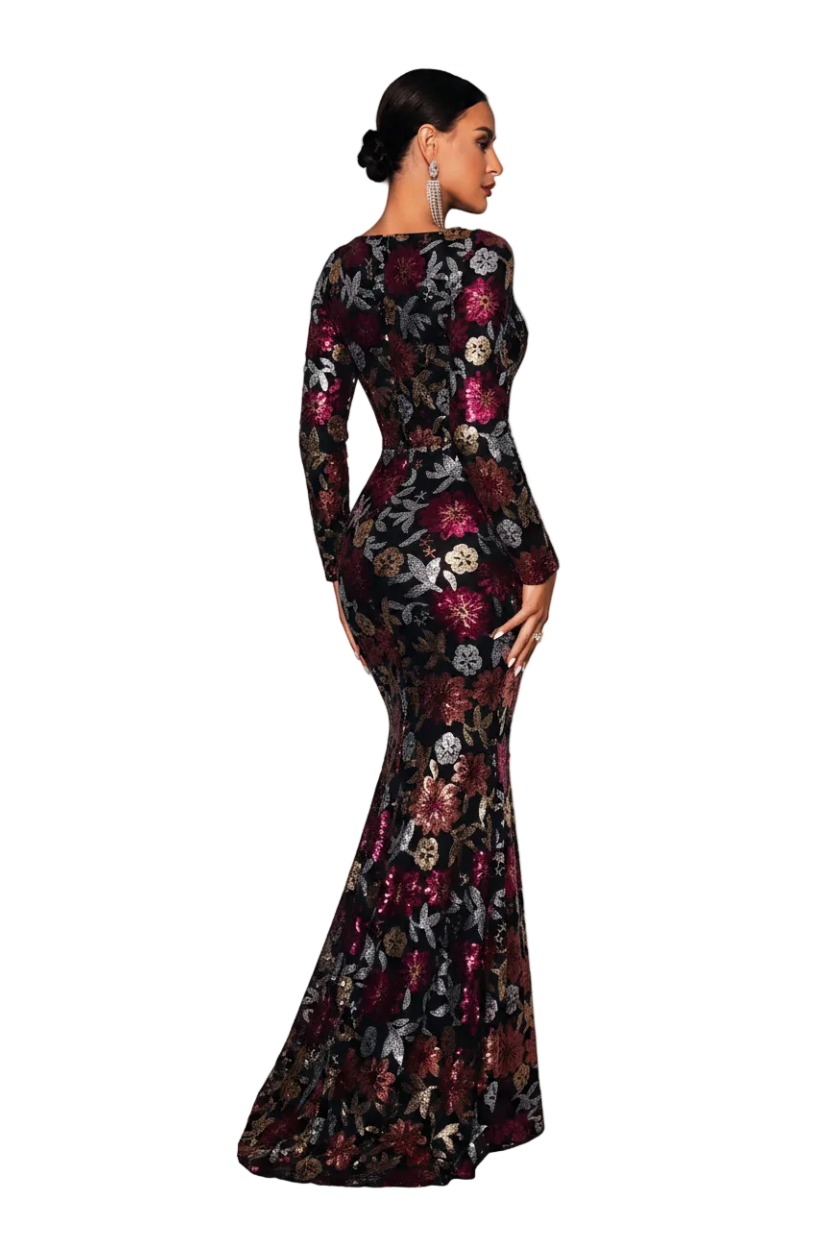 Woman in a floral evening gown standing on white cubes against a gray background, with 'YESDX' branding.