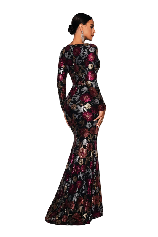Woman in a floral evening gown standing on white cubes against a gray background, with 'YESDX' branding.