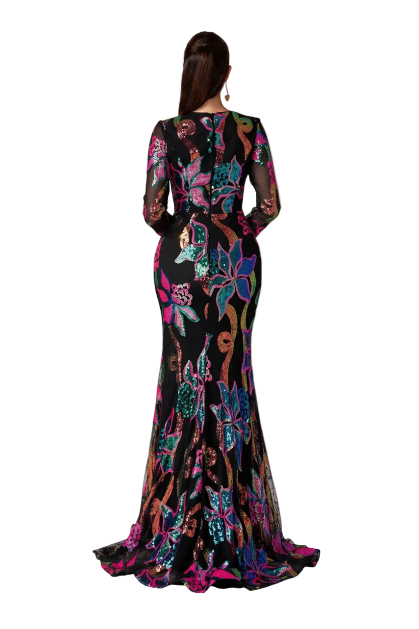 Woman wearing a colorful floral dress with an orange gradient background