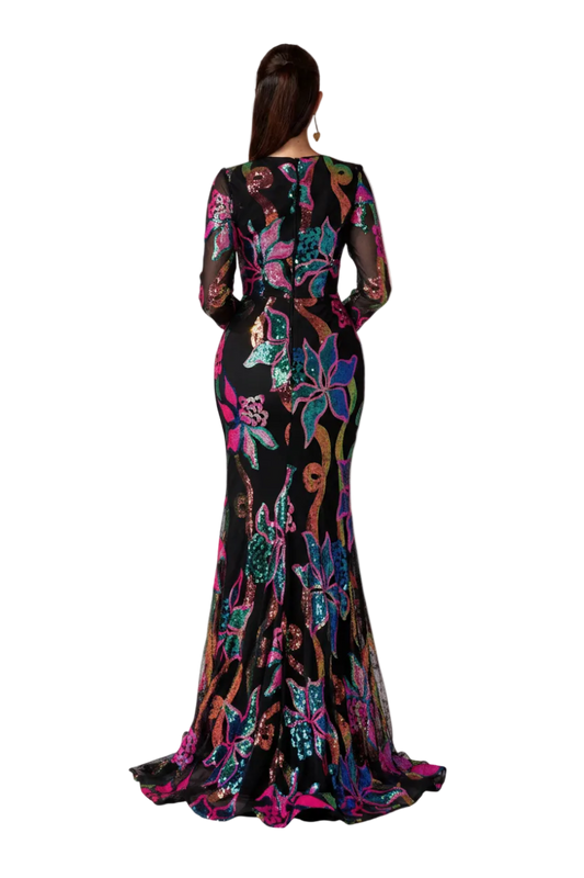 Woman wearing a colorful floral dress with an orange gradient background