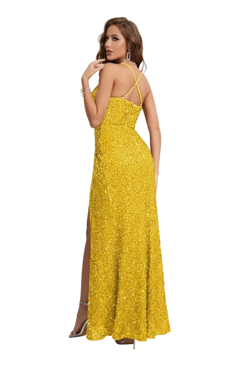 Woman in a yellow evening gown standing in a elegant room with floral arrangements.