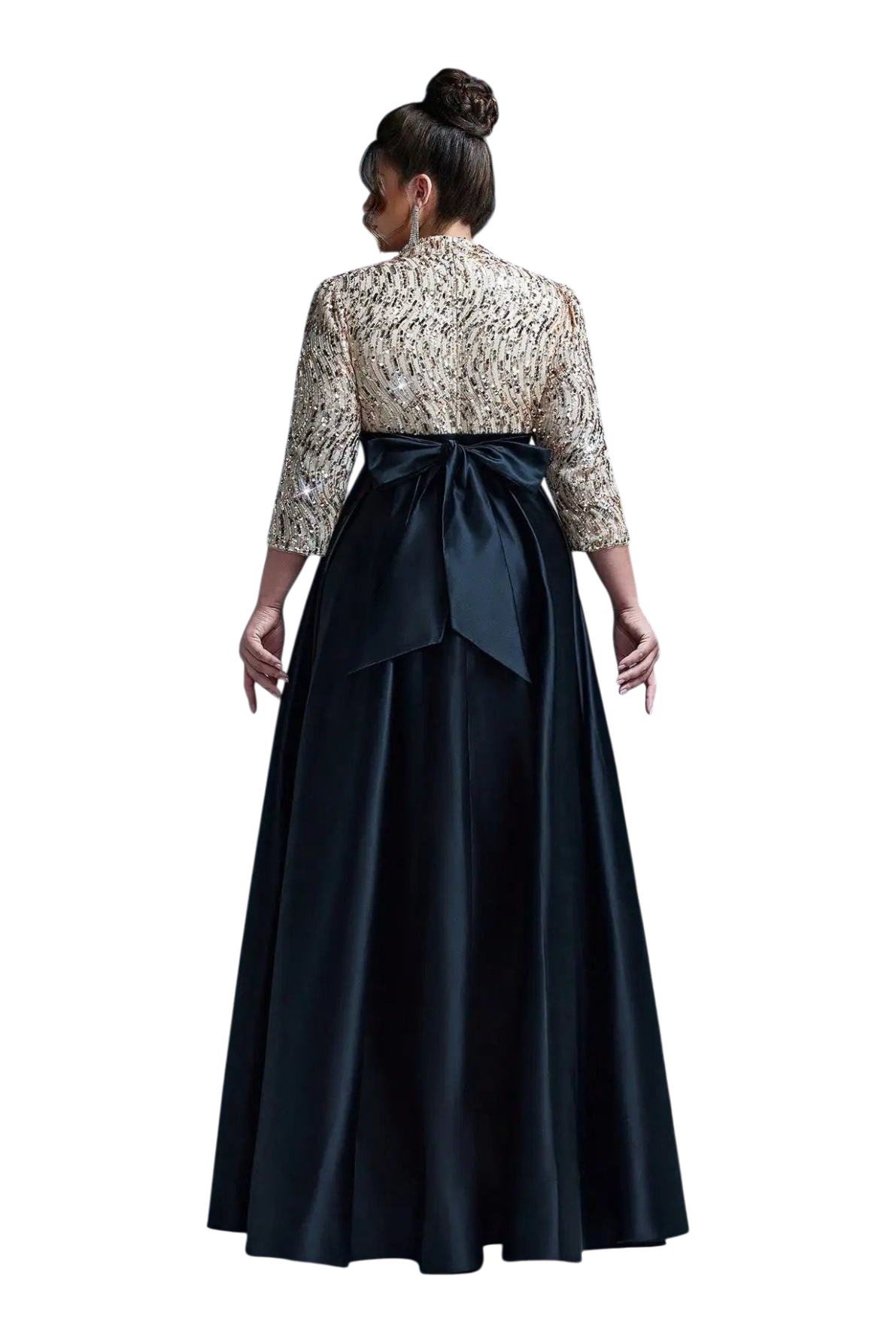 Woman wearing a floral blouse and black skirt against a gray background