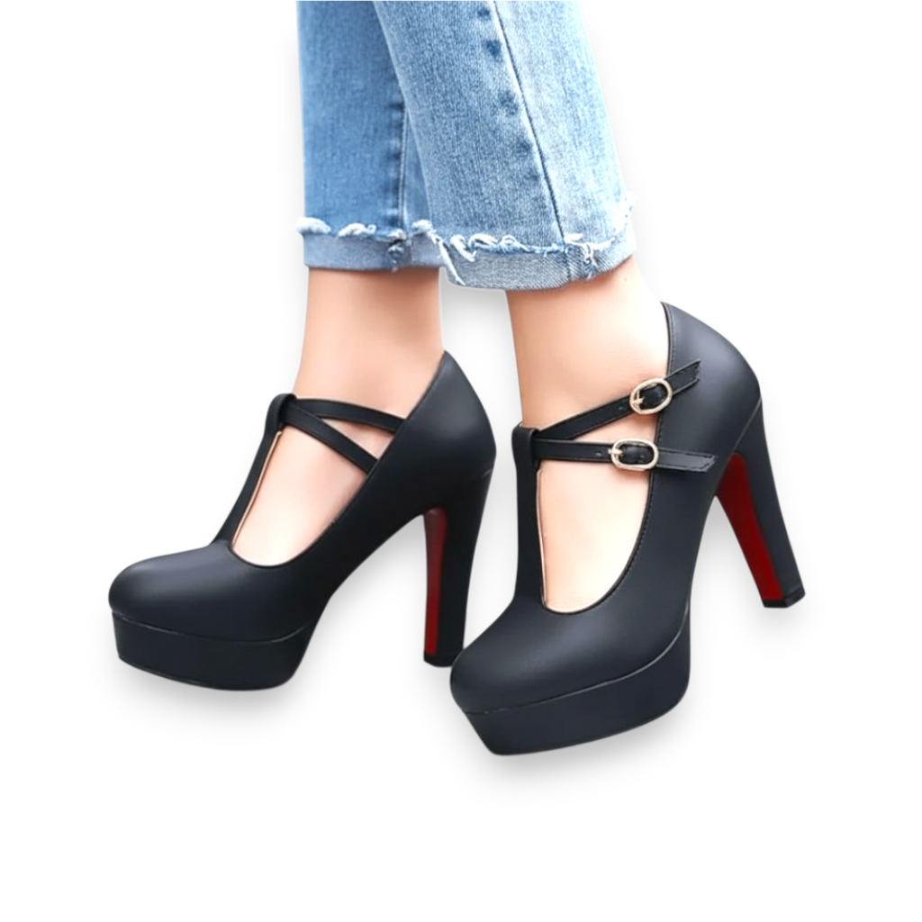 JASE Heart black platform heels with T-strap buckle detail and red soles worn with blue jeans